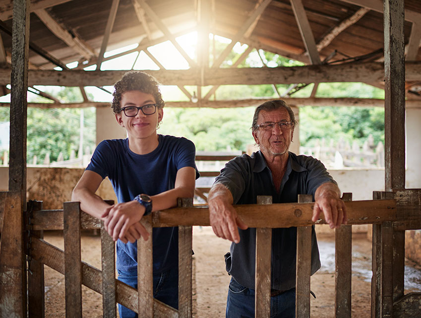 Two people inside of a stable