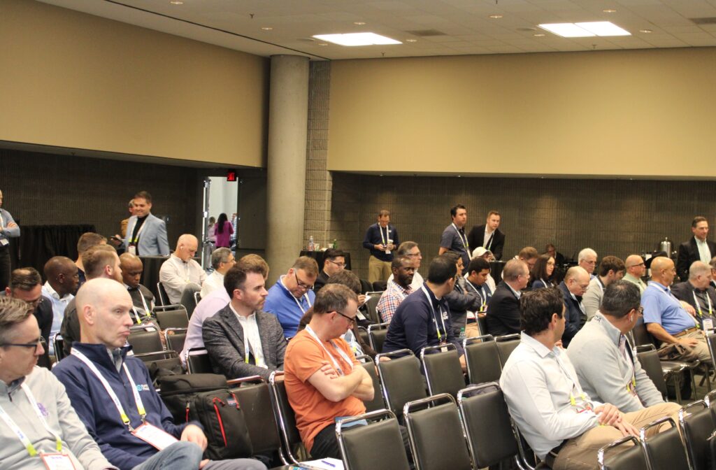 Crowd listening to speaker's presentation at NARA's Rendering Symposium.